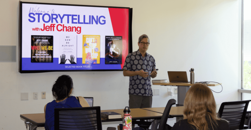 Chang at the front of a room speaking to event attendees