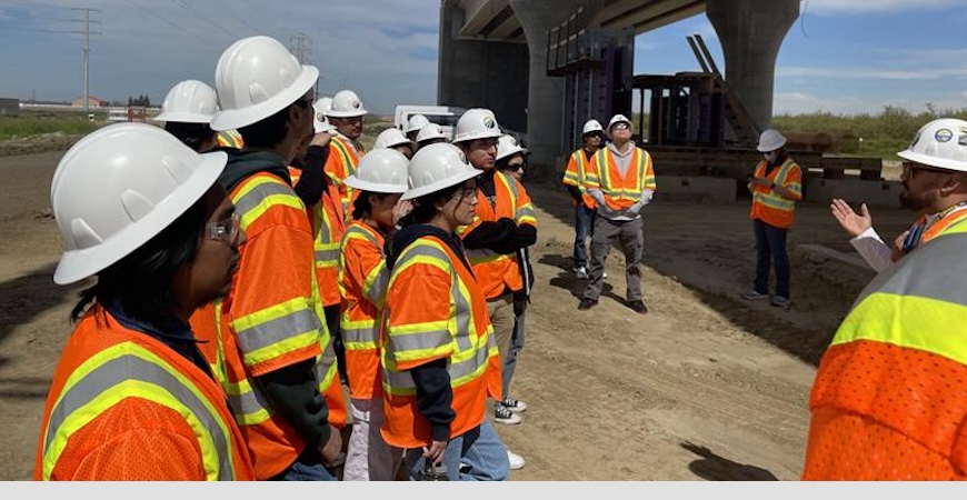 UC Merced students look at high-speed rail tracks during a site visit.